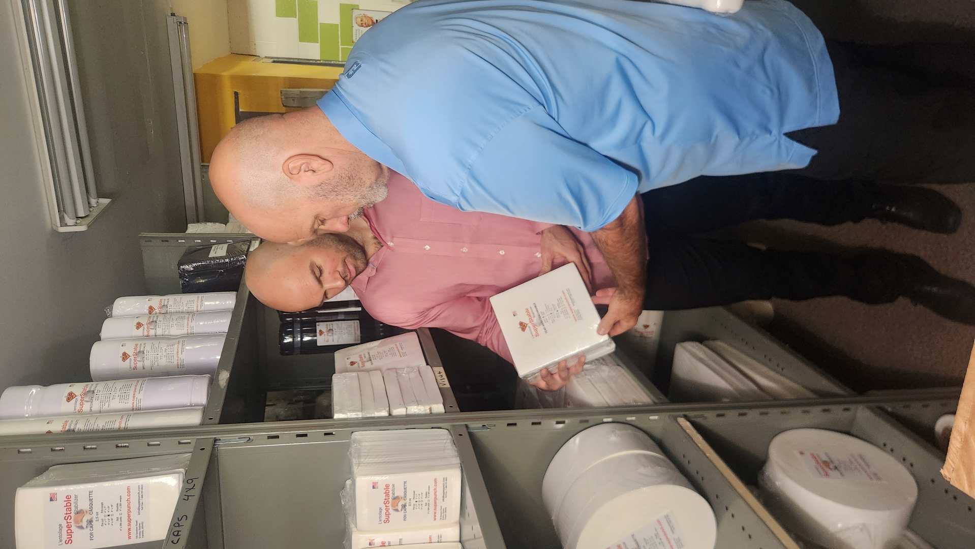 Johnny and Tommie Larochelle reviewing stabilizers in the warehouse